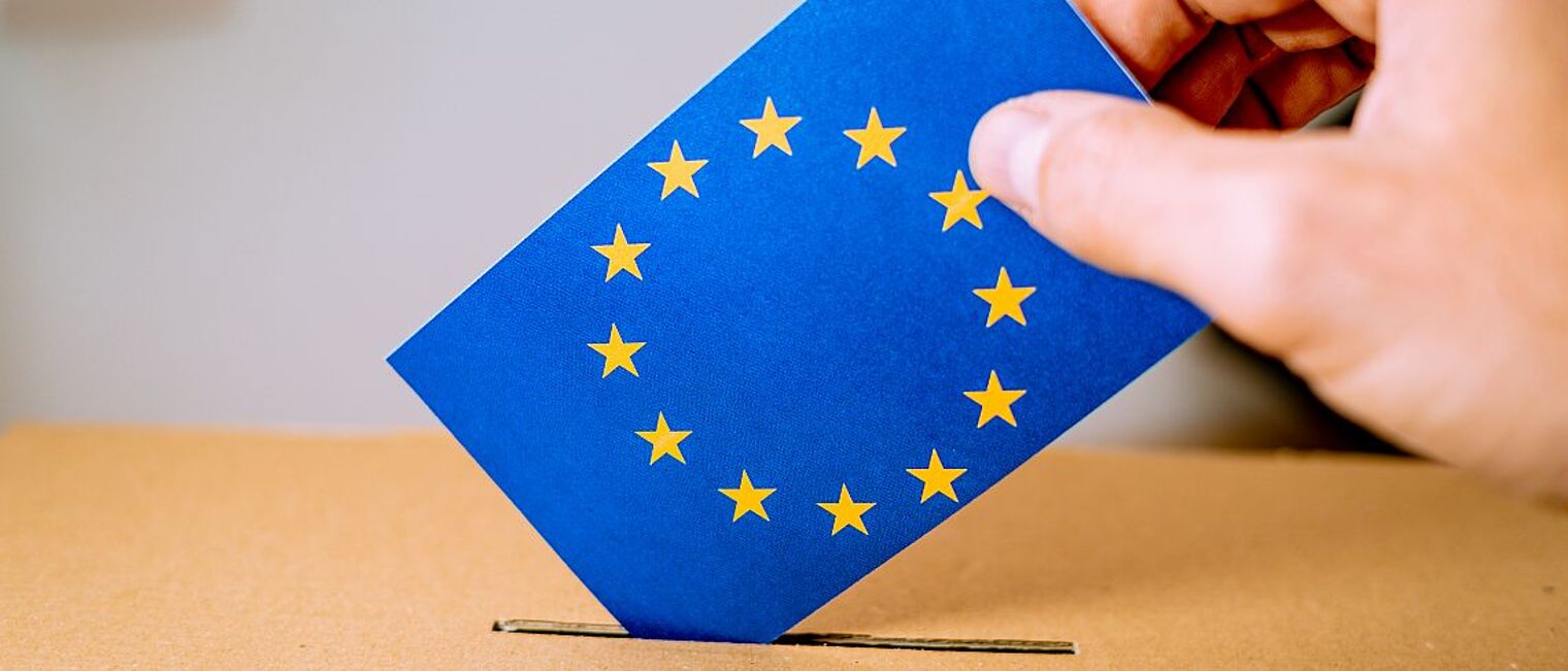 Election in European Union - voting at the ballot box. A hand putting an EU flag vote in the ballot box. Schlagwort(e): european, union, eu, flag, election, parliament, may, 2019, euro, politics, democracy, government, vote, candidate, president, brexit, ballot, choice, national, political, referendum, voting, europe, box, hand, nation, paper, polling, presidential, voter, campaign, choose, citizen, container, person, decision, envelope, give, holding, nationality, throw, politician, democratic, elect, freedom, man, opinion, parliamentary, party, poll, european, union, eu, flag, election, parliament, may, 2019, euro, politics, democracy, government, vote, candidate, president, brexit, ballot, choice, national, political, referendum, voting, europe, box, hand, nation, paper, polling, presidential, voter, campaign, choose, citizen, container, person, decision, envelope, give, holding, nationality, throw, politician, democratic, elect, freedom, man, opinion, parliamentary, party, poll